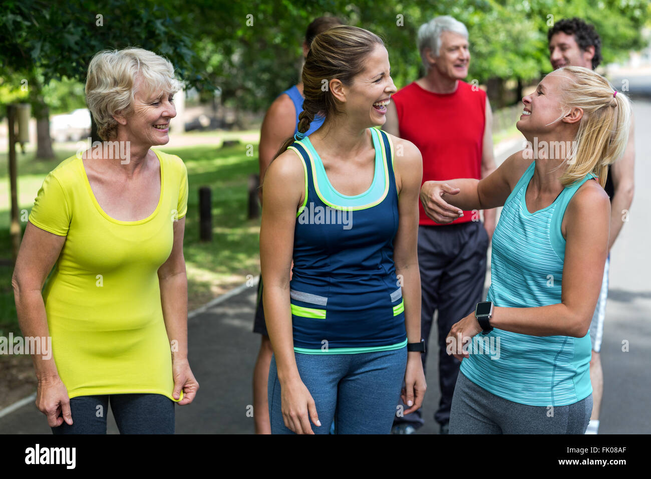 Marathon female athletes laughing together Stock Photo