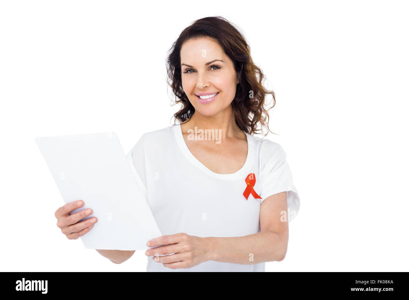 Woman wearing red aids awareness ribbon reading test result Stock Photo