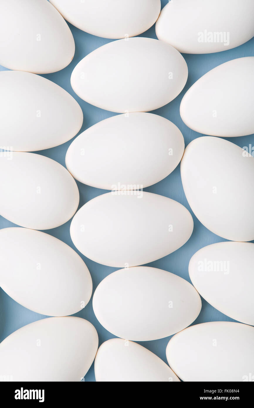 group of white eggs on blue background Stock Photo