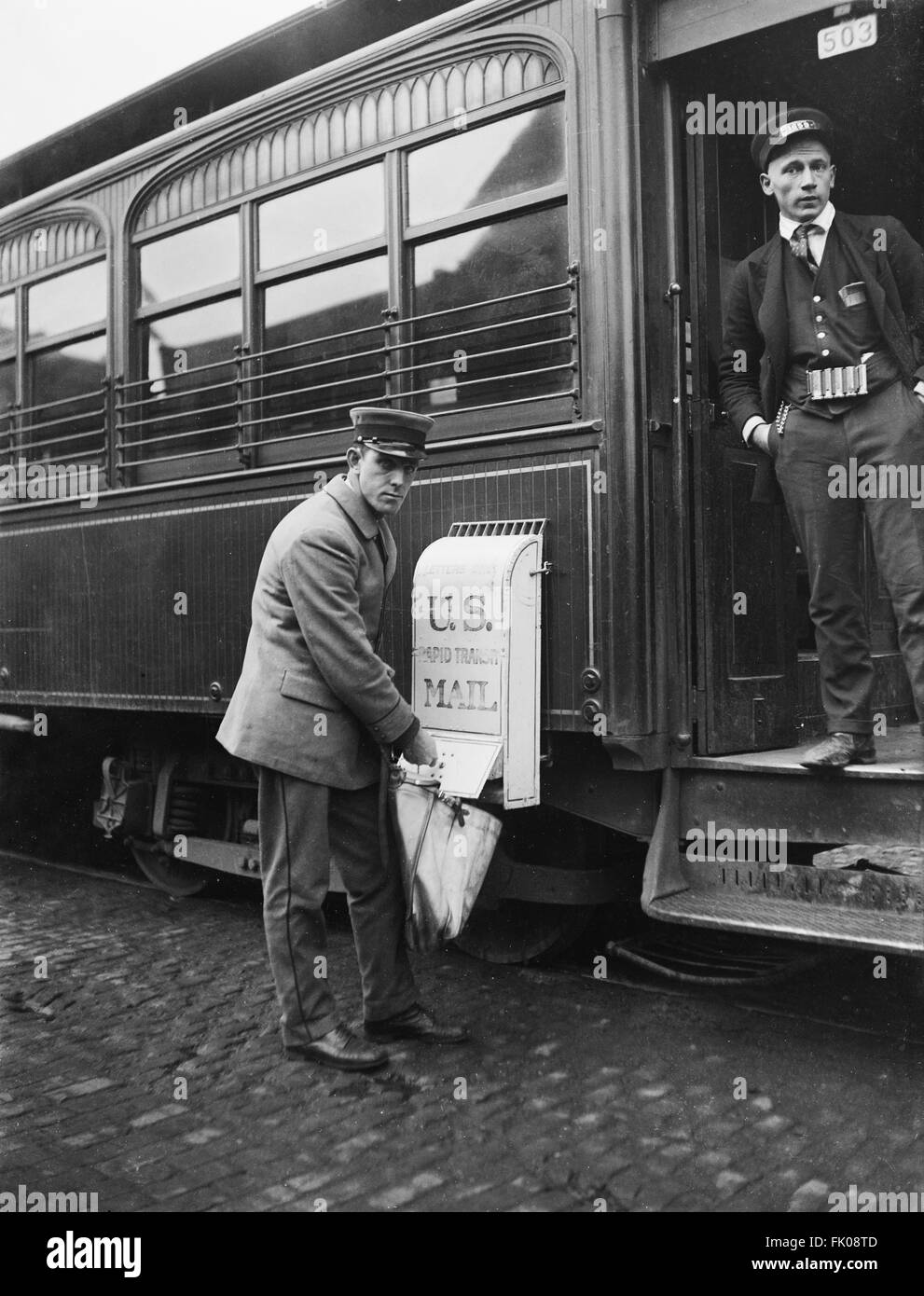 Mailman collecting Mail from Train Mailbox, USA, Harris & Ewing, 1921 Stock Photo