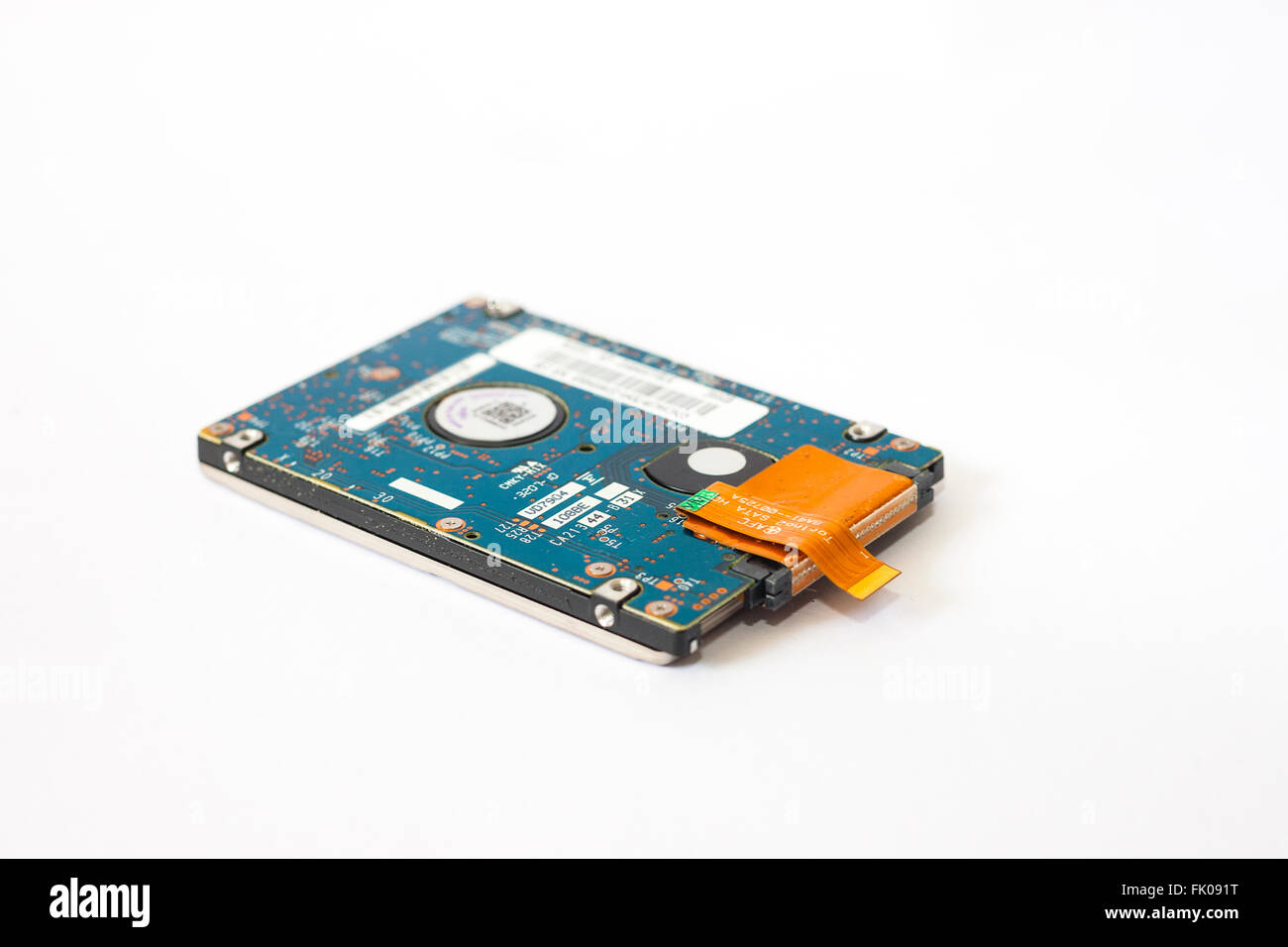 London, UK. Laptop hard disk disconnected on plain white Stock Photo