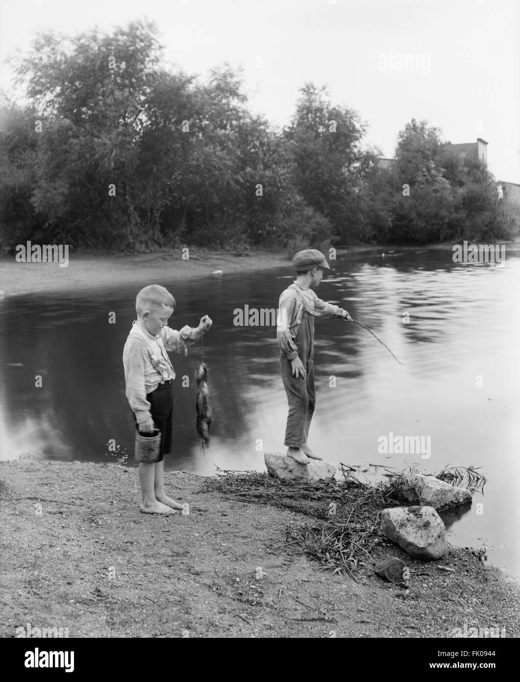 Two Boys Fishing, Summit, Illinois, USA, circa 1900 Stock Photo - Alamy