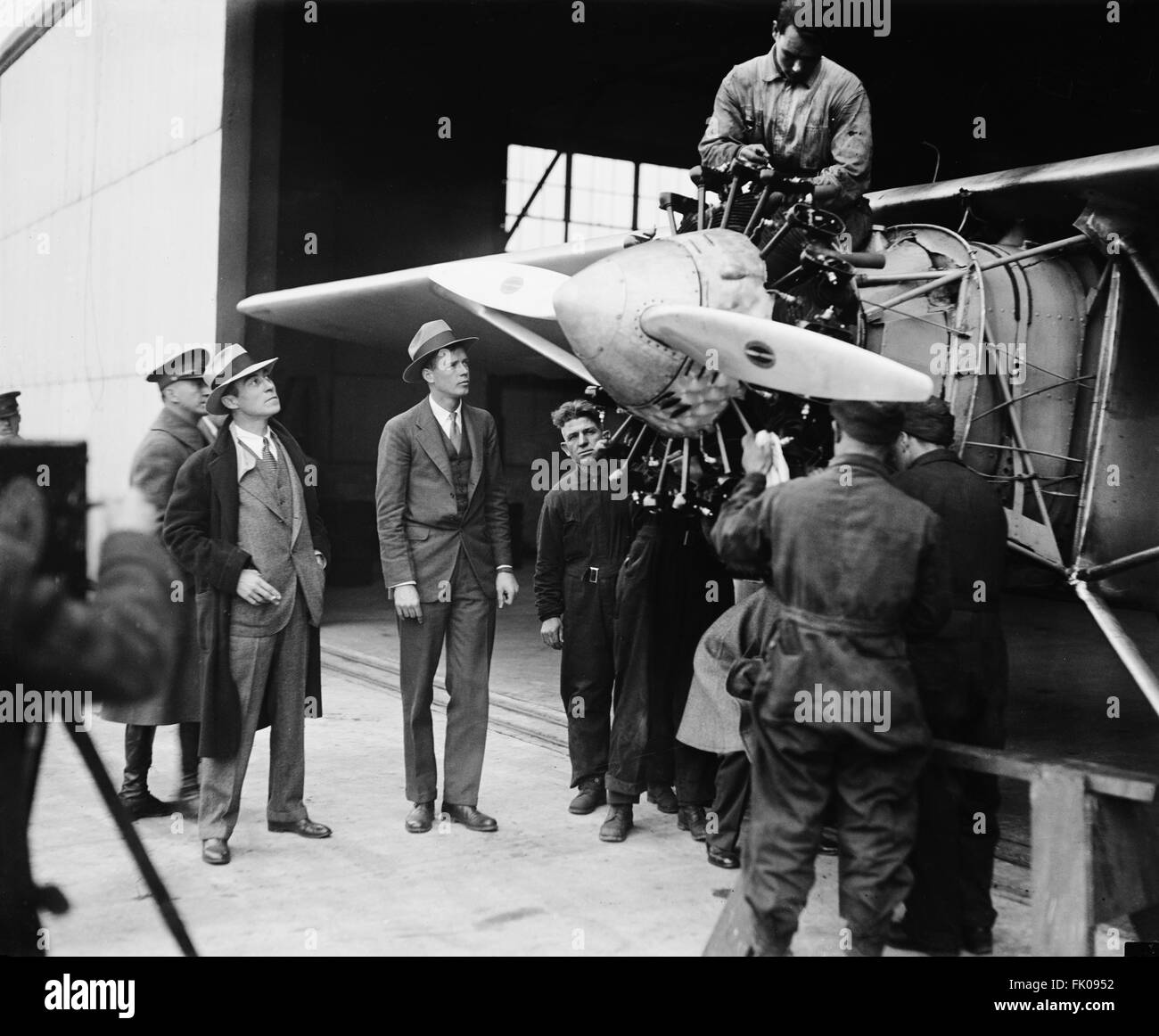 Charles Lindbergh and Group of Men with Airplane, Spirit of St. Louis, circa 1927.jpg Stock Photo