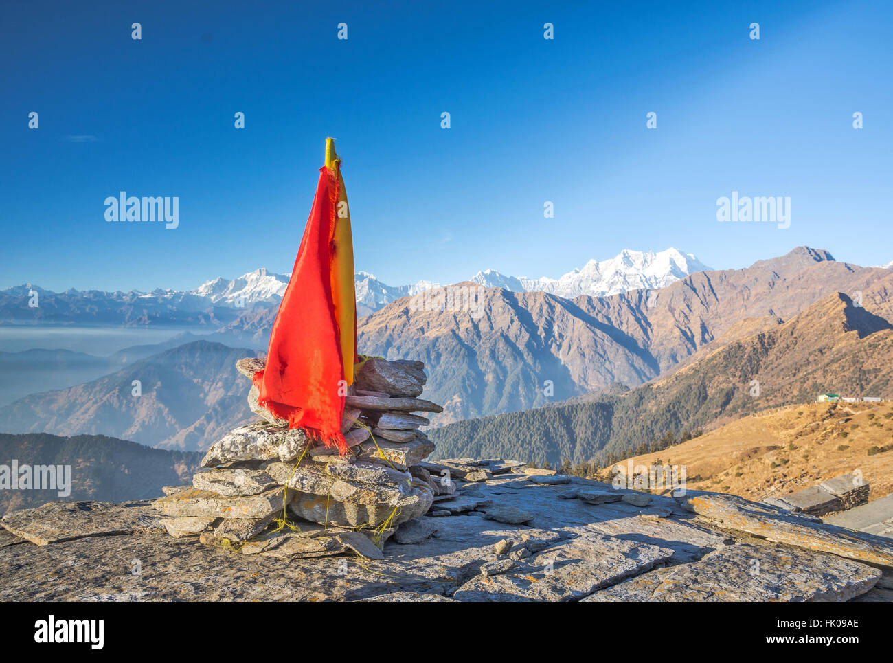 A religious flag topped on Hindu temple in Himalaya Stock Photo