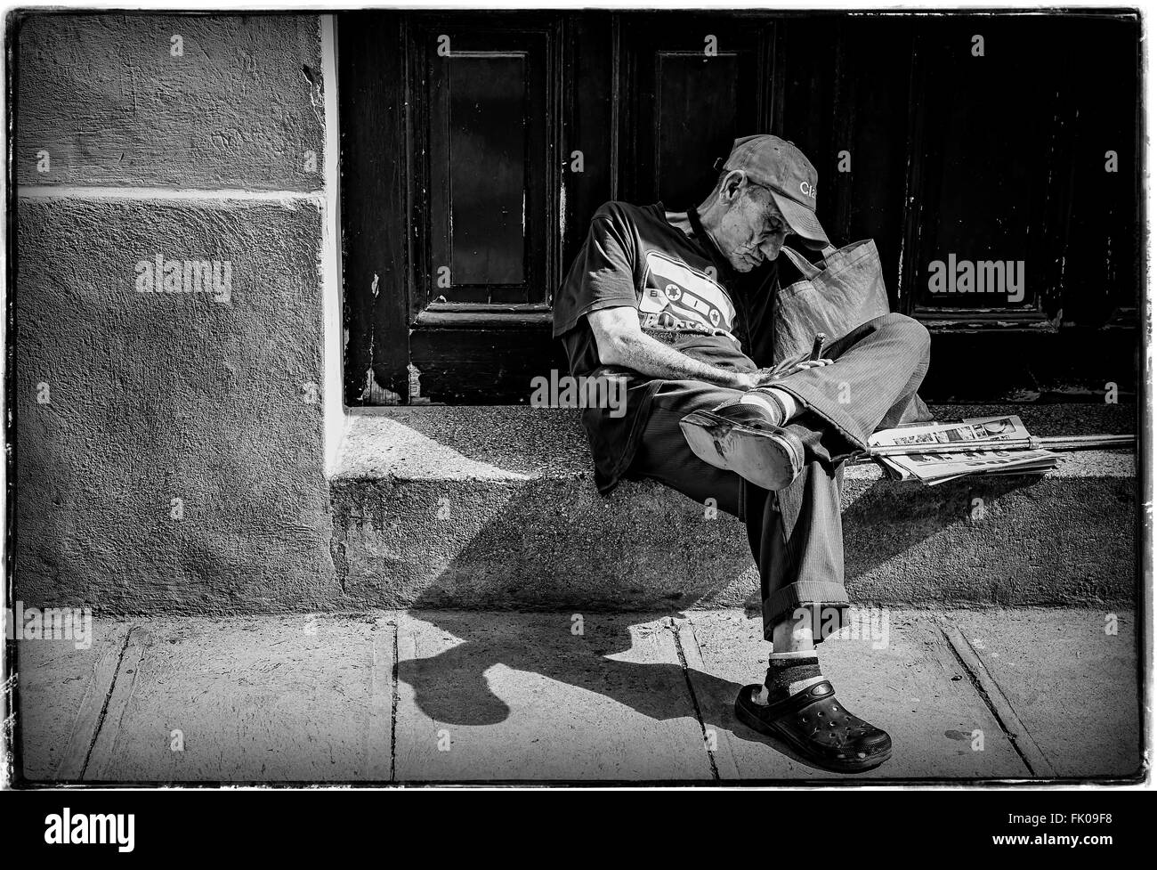 Old man asleep with Cigar in Old Havana, Cuba Stock Photo