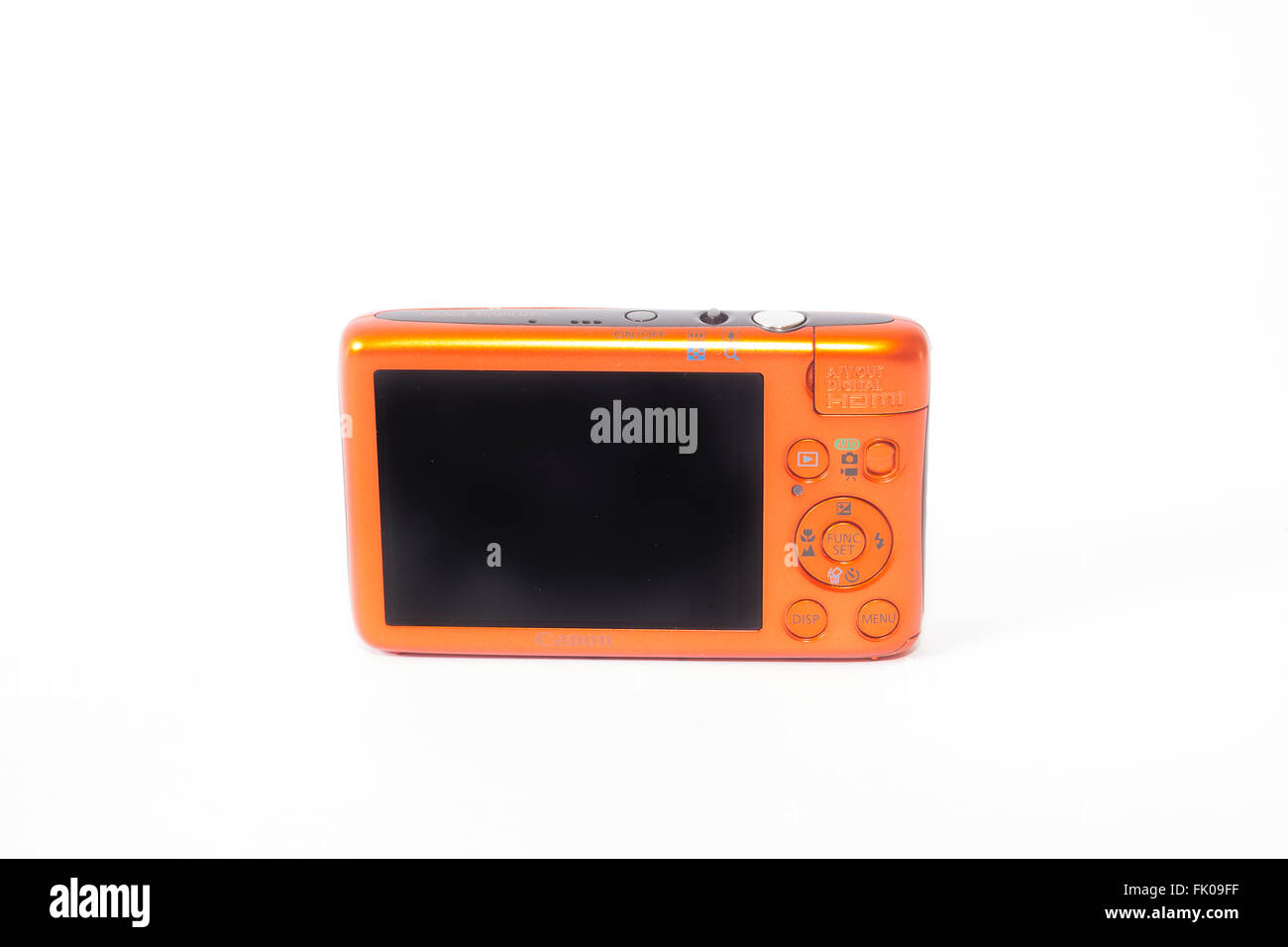London, UK. Canon Ixus 130 compact digital camera in orange. Stock Photo