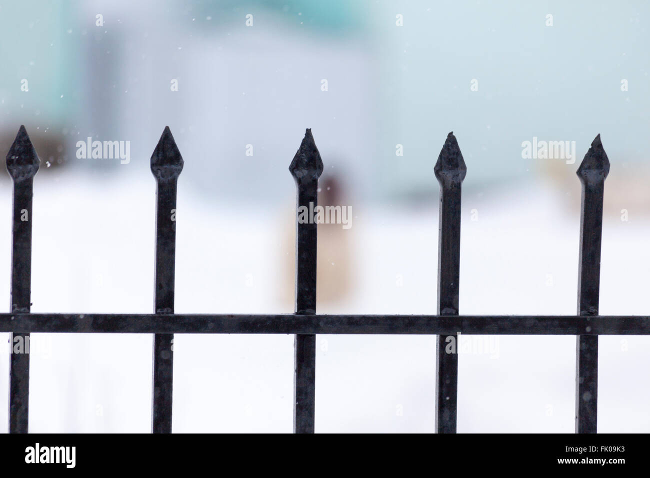 Strong metal fence with blurred background Stock Photo - Alamy