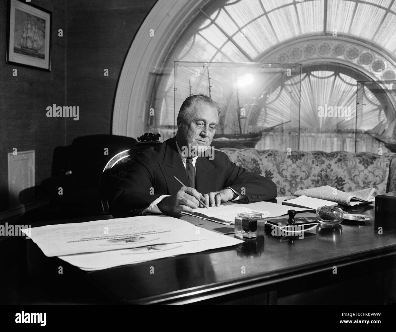 U.S. President Franklin Roosevelt Signing Bills at White House, Washington DC, USA, circa 1936.jpg Stock Photo