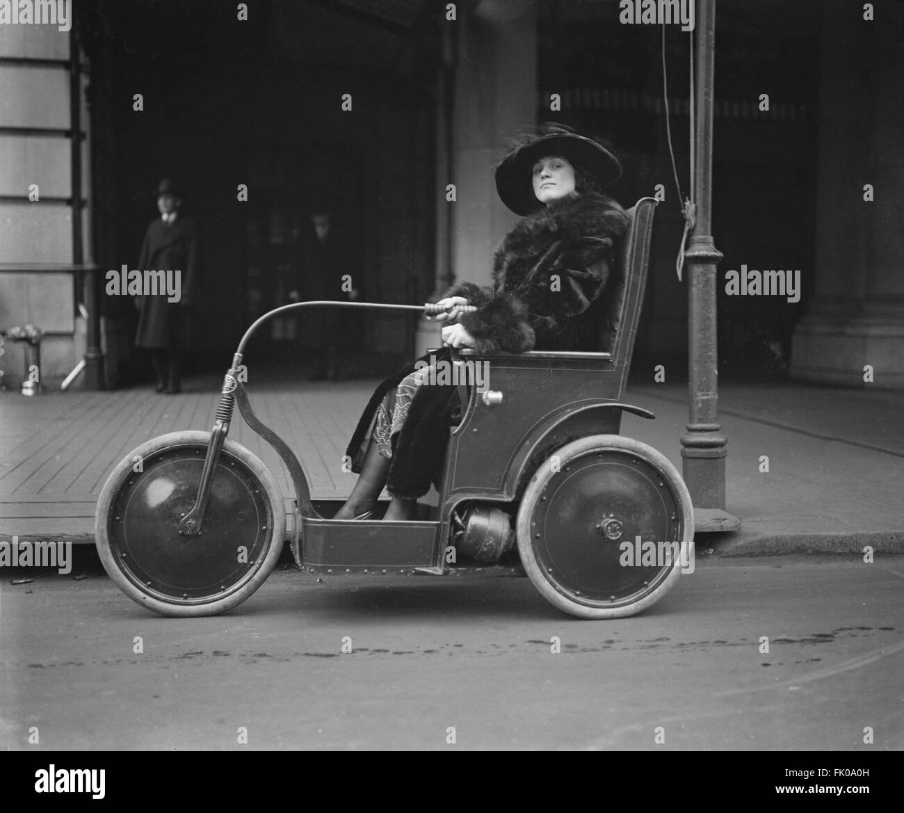 Woman in Three-Wheeled Vehicle, USA, circa 1922 Stock Photo