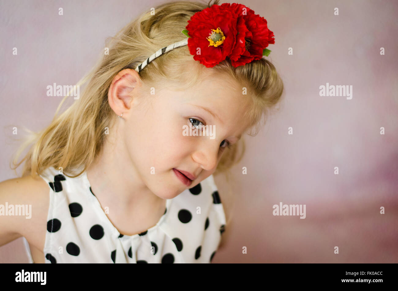 portrait of girl with corn rose in hair Stock Photo