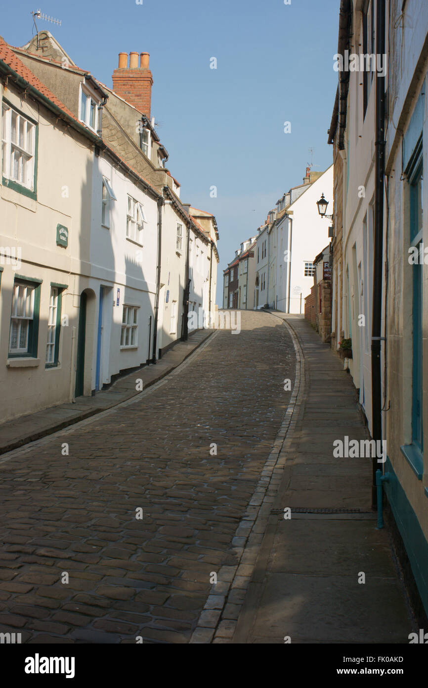 Henrietta Street, Whitby, a narrow cobbled street lined by whitewashed
