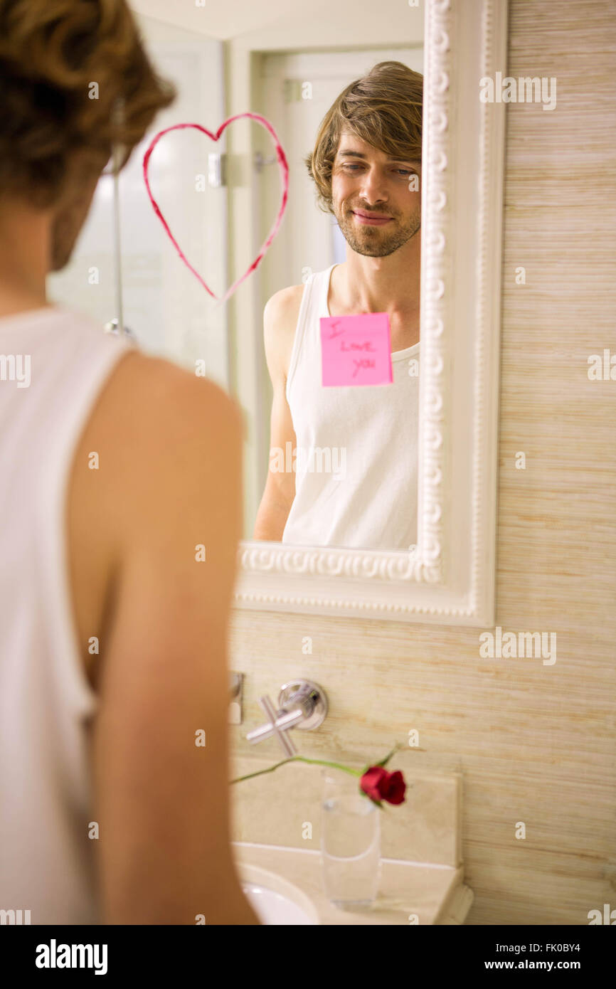 Boyfriend discovering a love message on the mirror Stock Photo