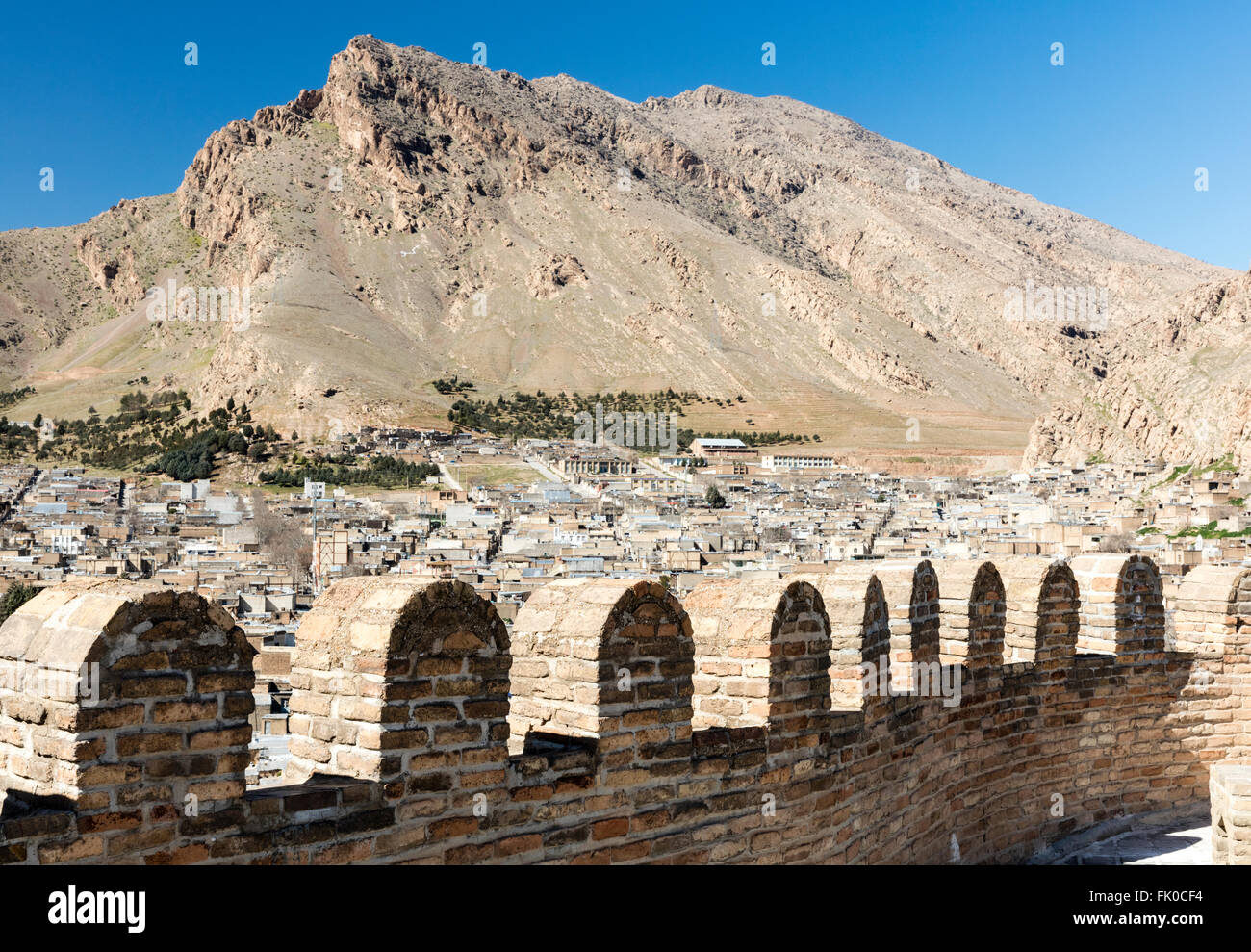 Town of Khorrambad in Lorestan Iran seen from Sassanid citadel of Falak Ol Aflak. Zagros mountains lie behind the town. Stock Photo