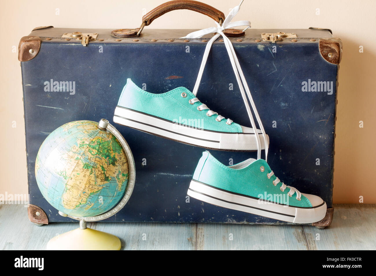 Travel concept with holiday suitcase, shoes and globe concept Stock Photo