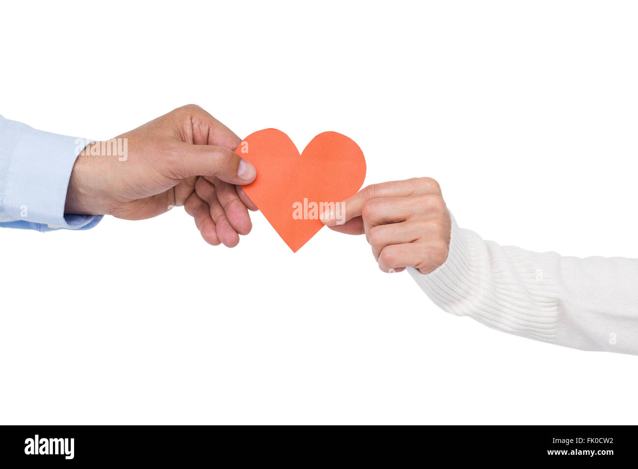 Couple holding paper heart Stock Photo