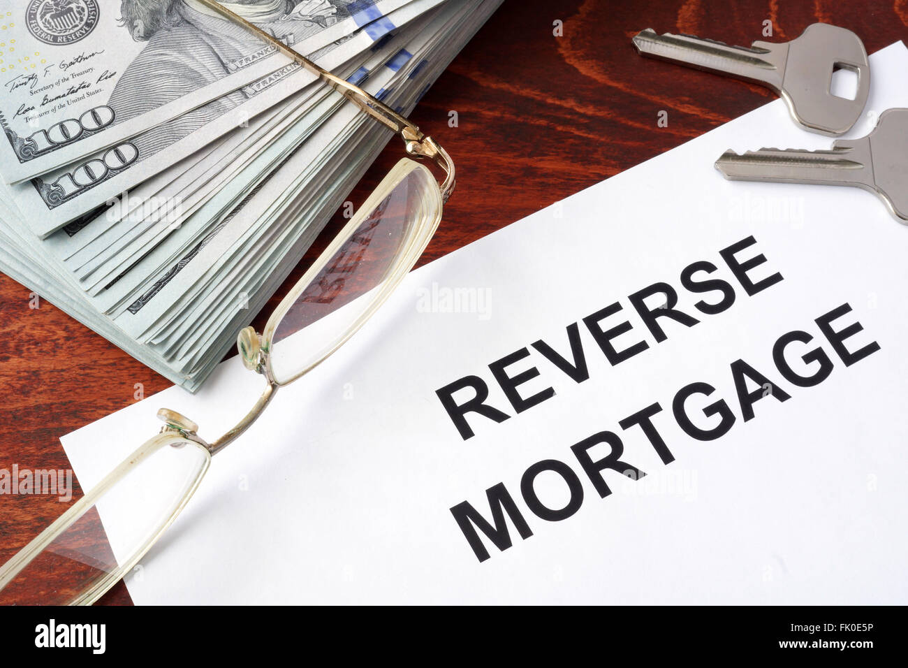 Reverse mortgage form on a table and money. Stock Photo