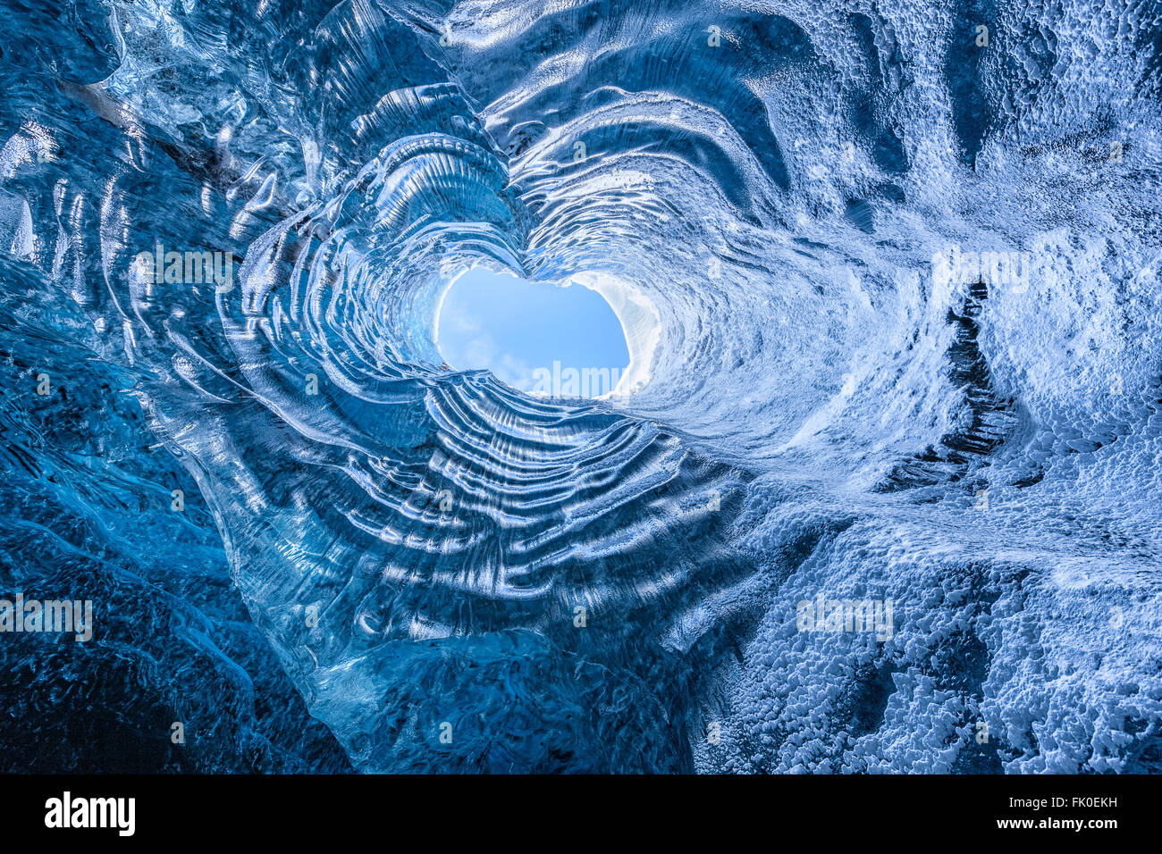 Looking up through a opening in a glacier cave in Iceland Stock Photo