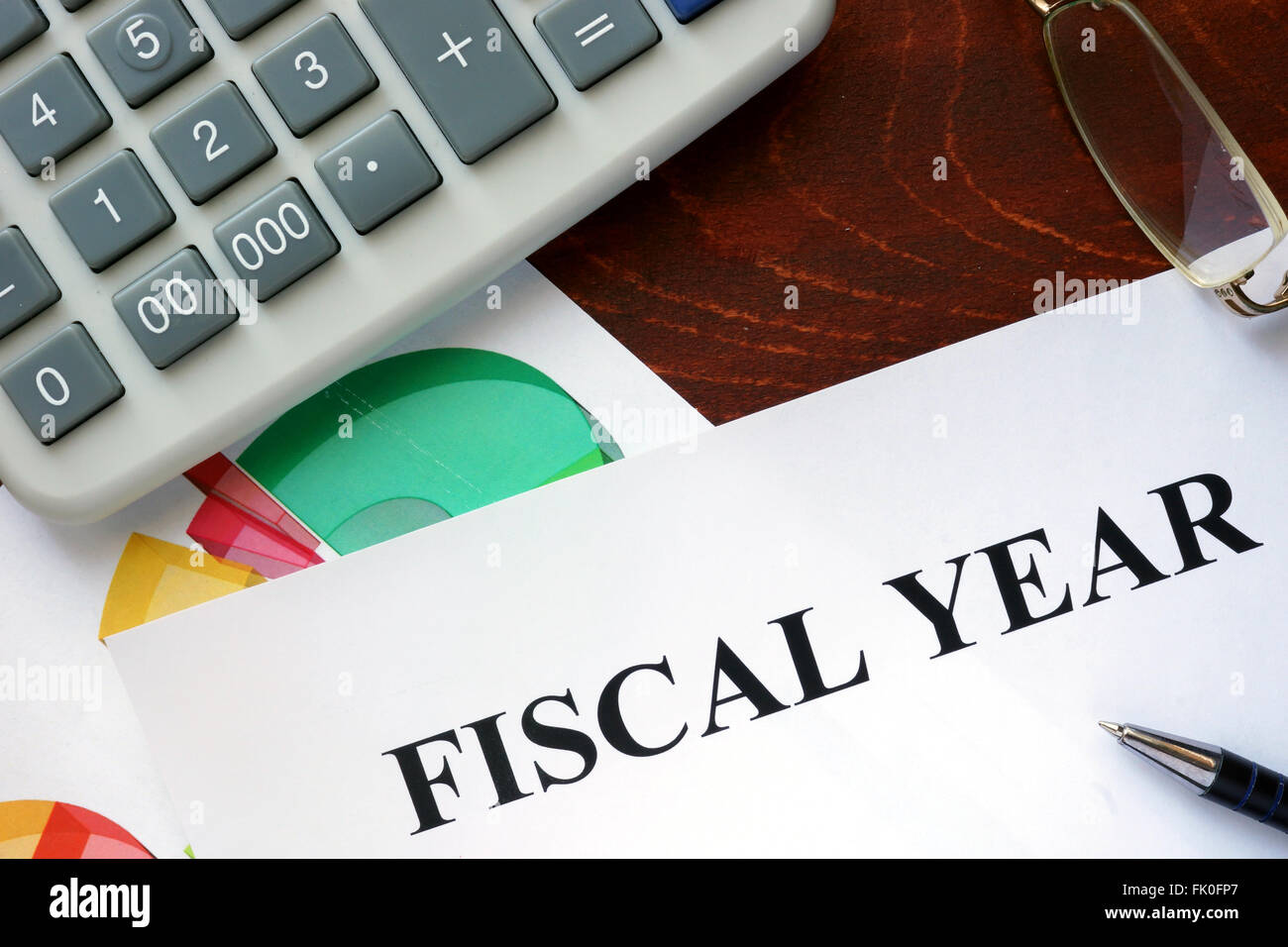 Paper with Fiscal year and charts. Stock Photo