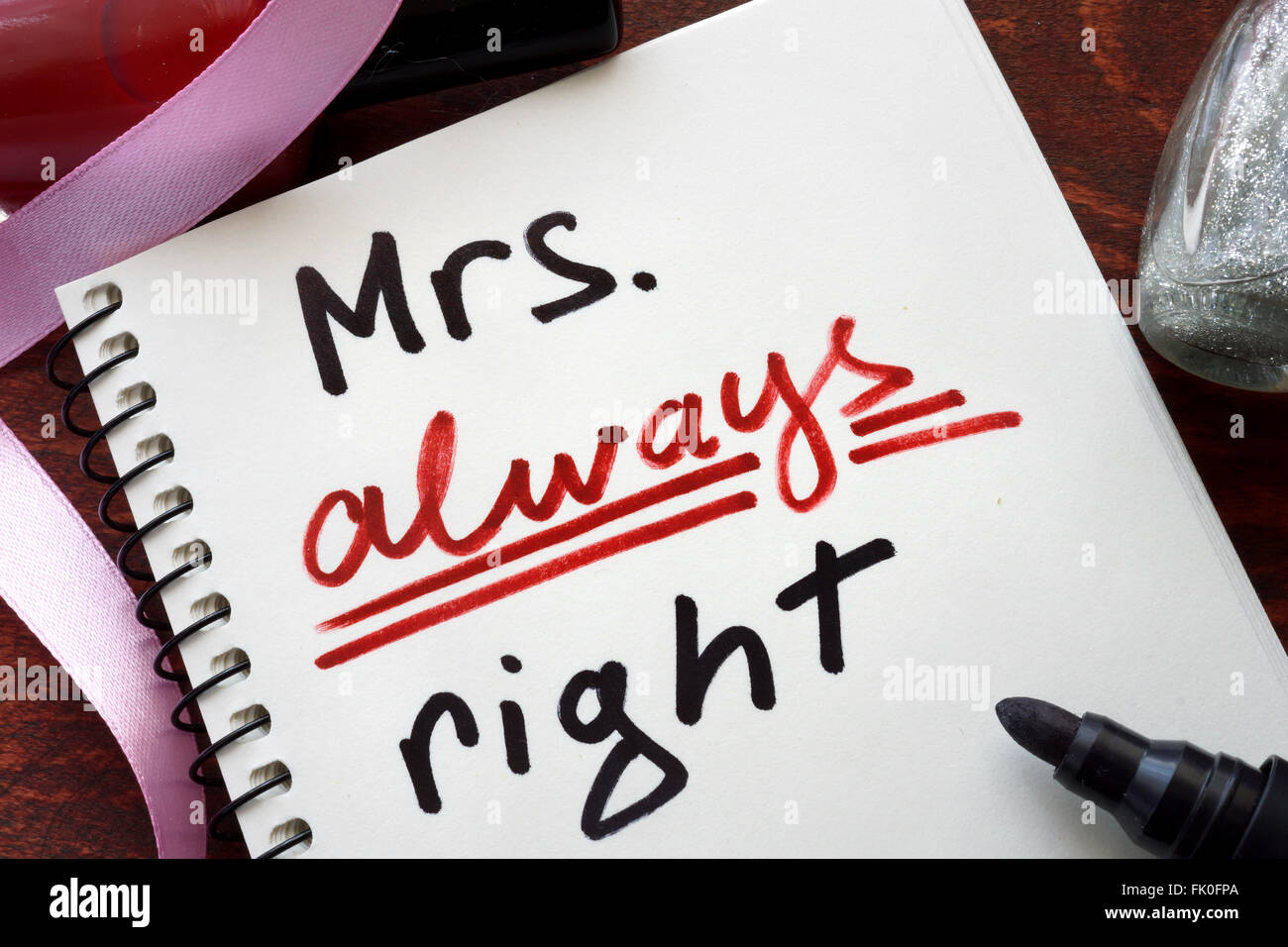 Mrs always right concept  written in a notebook on a wooden table. Stock Photo