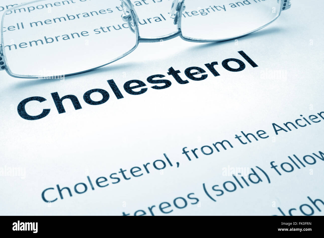 Paper with word cholesterol   and glasses. Stock Photo