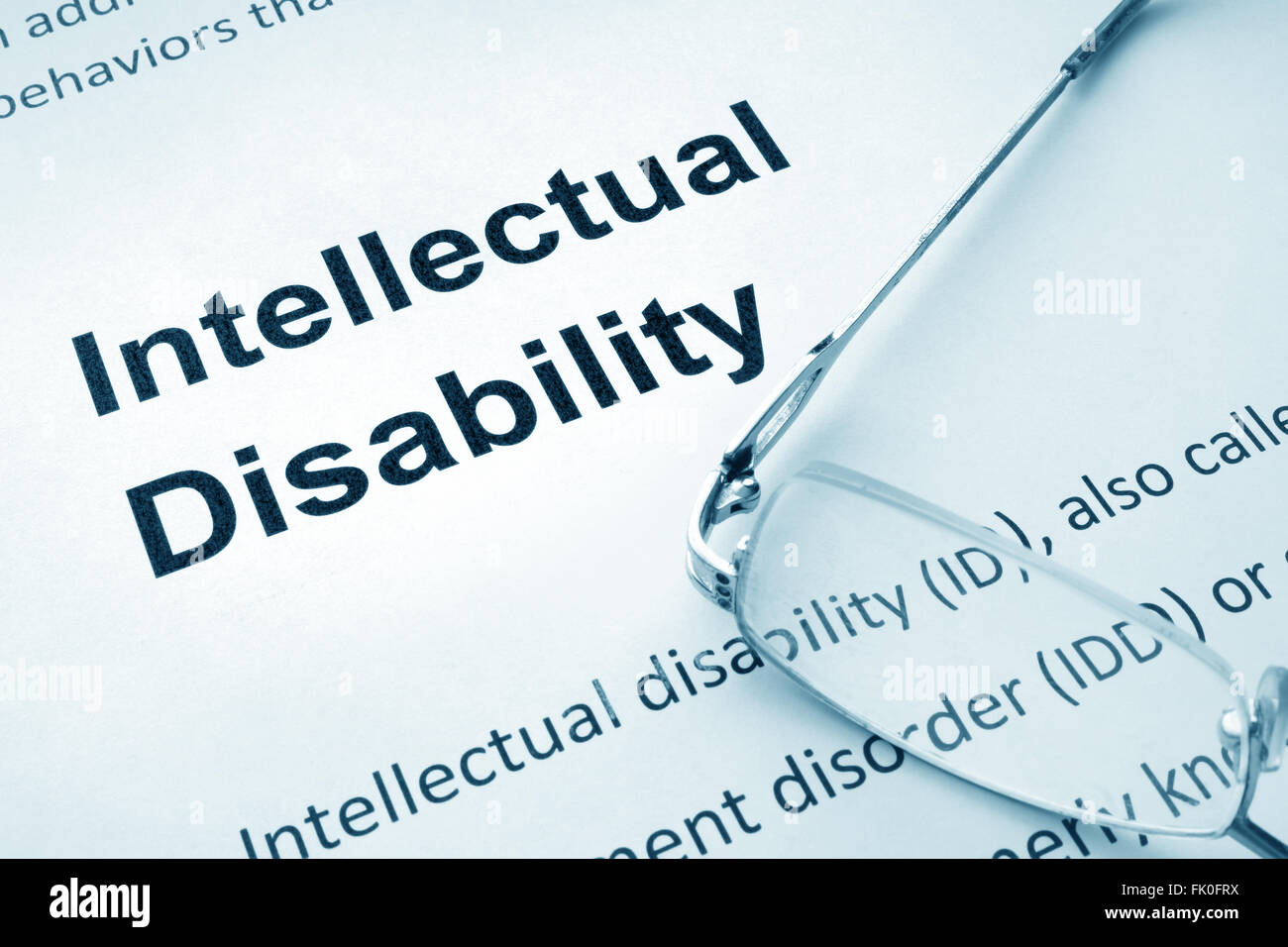 Paper with words  intellectual disability and glasses. Stock Photo