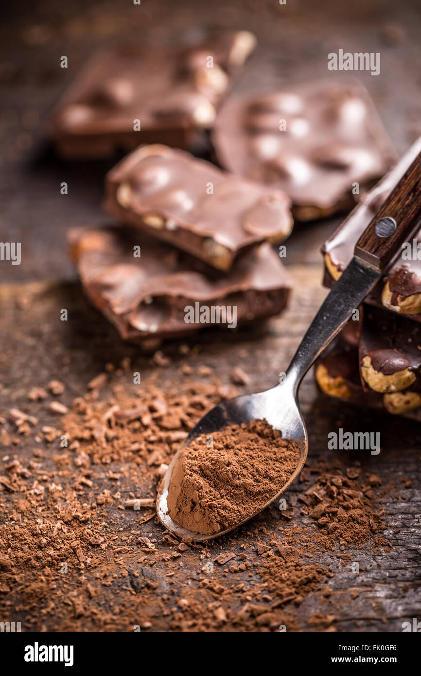 Chocolate with nuts on wooden background Stock Photo