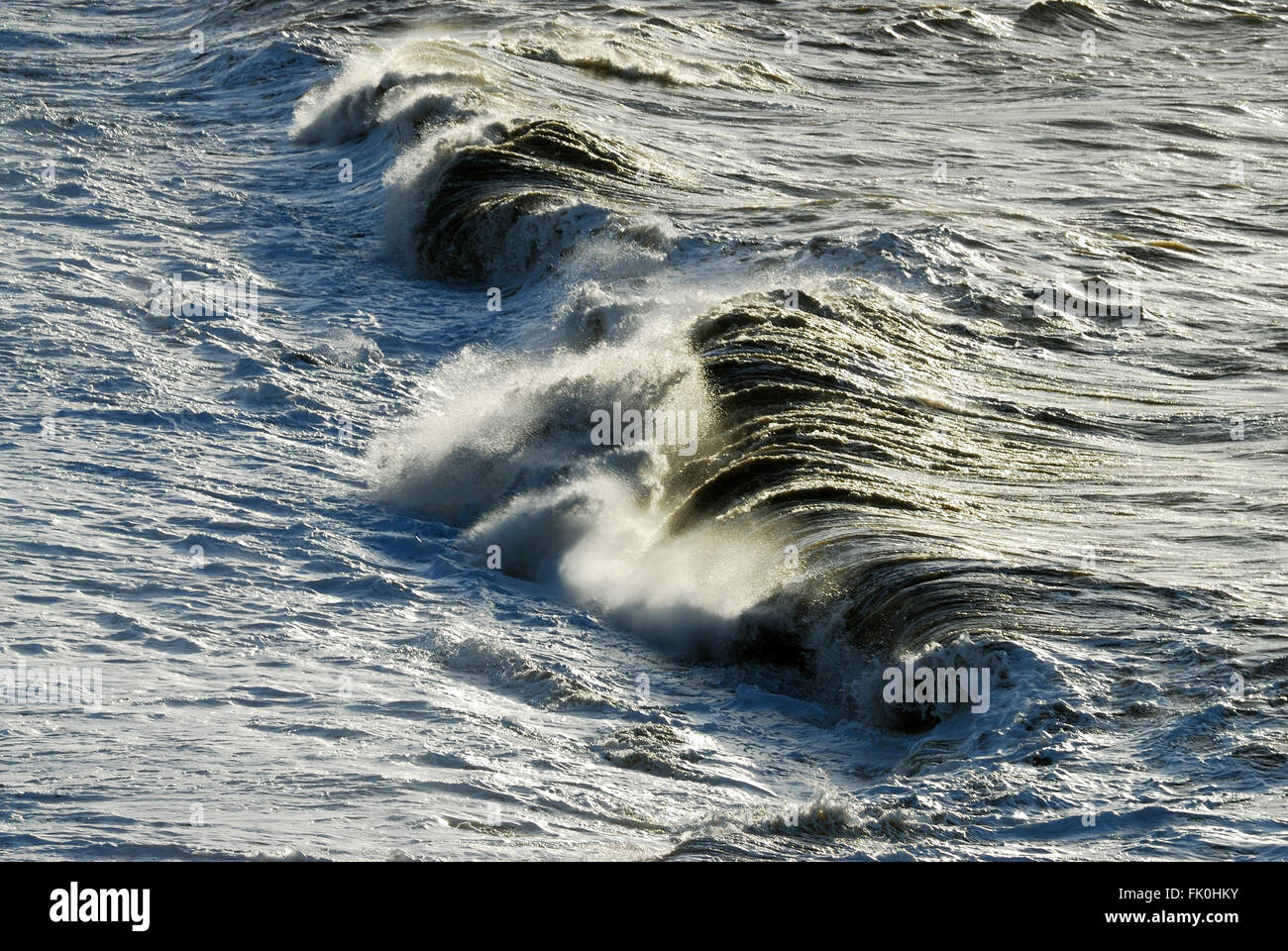 Waves breaking at Burton Bradstock, Dorset, UK. February 2012 Stock Photo