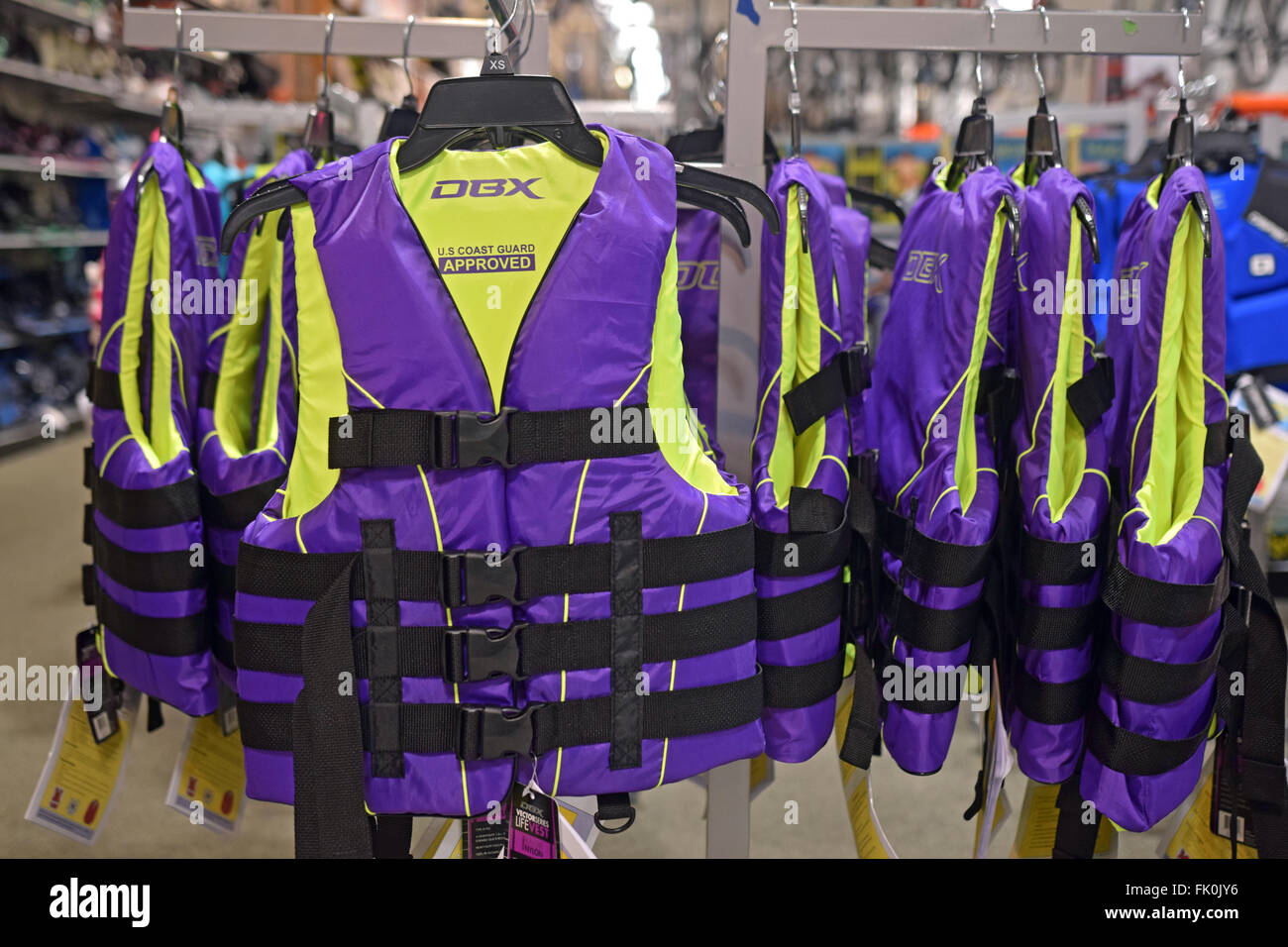 Colorful DBX purple lifejackets for sale at Dick's Sporting Goods at the Roosevelt Field Mall in Garden City, Long Island, NY Stock Photo