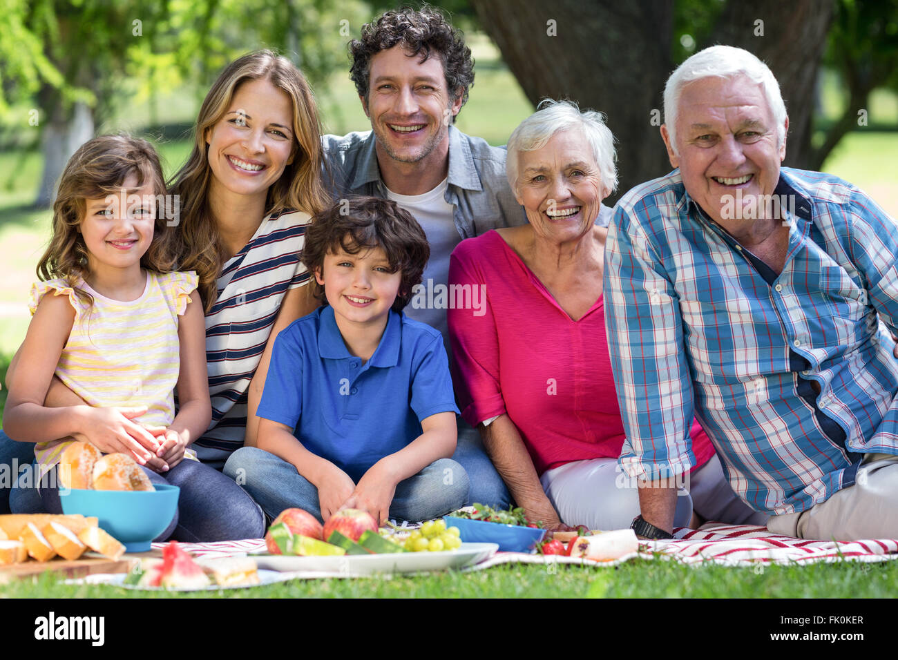 Smiling family having a picnic Stock Photo - Alamy