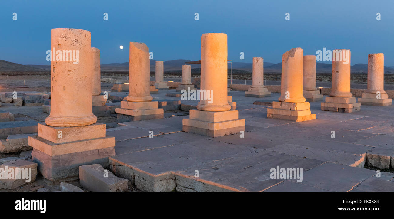 Columns of palace audience hall and rising moon at Pasargardae, the site of the tomb of Cyrus the Great. Archaemenid era. Iran Stock Photo