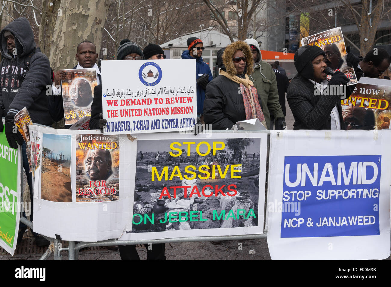 New York, United States. 04th Mar, 2016. Activists hold signs and chant, demanding the arrest of Omar al-Bashir. On the seventh anniversary of the first issuance by the International Criminal Court of an arrest warrant for Sudanese President Omar Al-Bashir related to the crisis in Darfur, a group of activist rallied in Dag Hammarskjold Plaza across from UN Headquarters in New York City to demand that the UN Security Council exert its authority to help bring al-Bashir under arrest. Credit:  Albin Lohr-Jones/Pacific Press/Alamy Live News Stock Photo