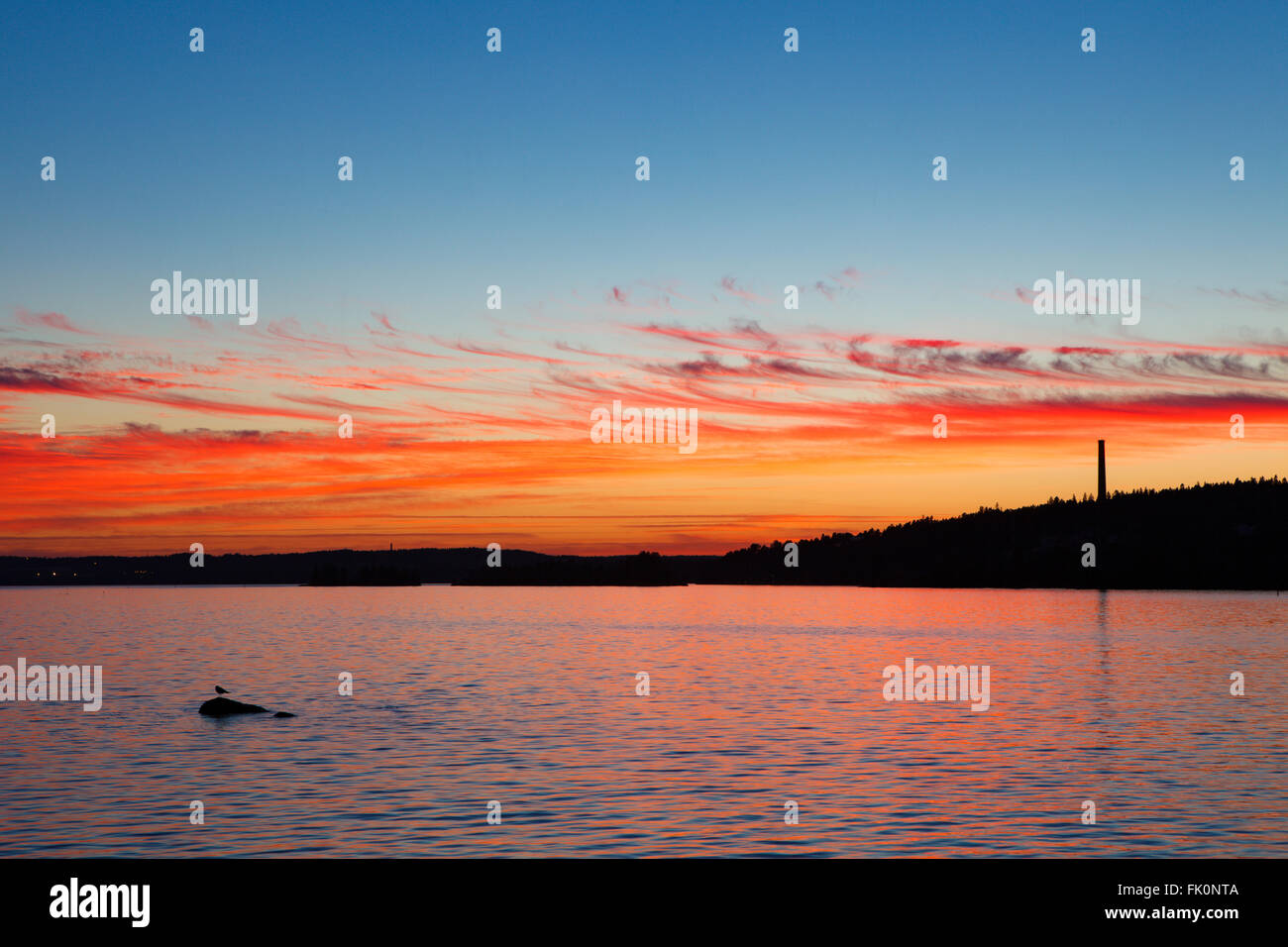 Calm sunset and clouds over lake Stock Photo - Alamy