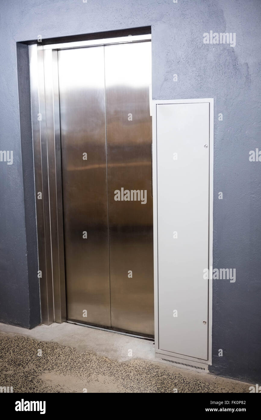 Modern elevator with closed door Stock Photo
