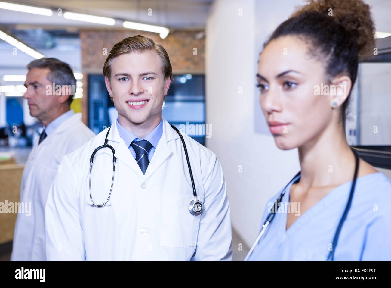 Portrait of male doctor smiling in hospital Stock Photo - Alamy