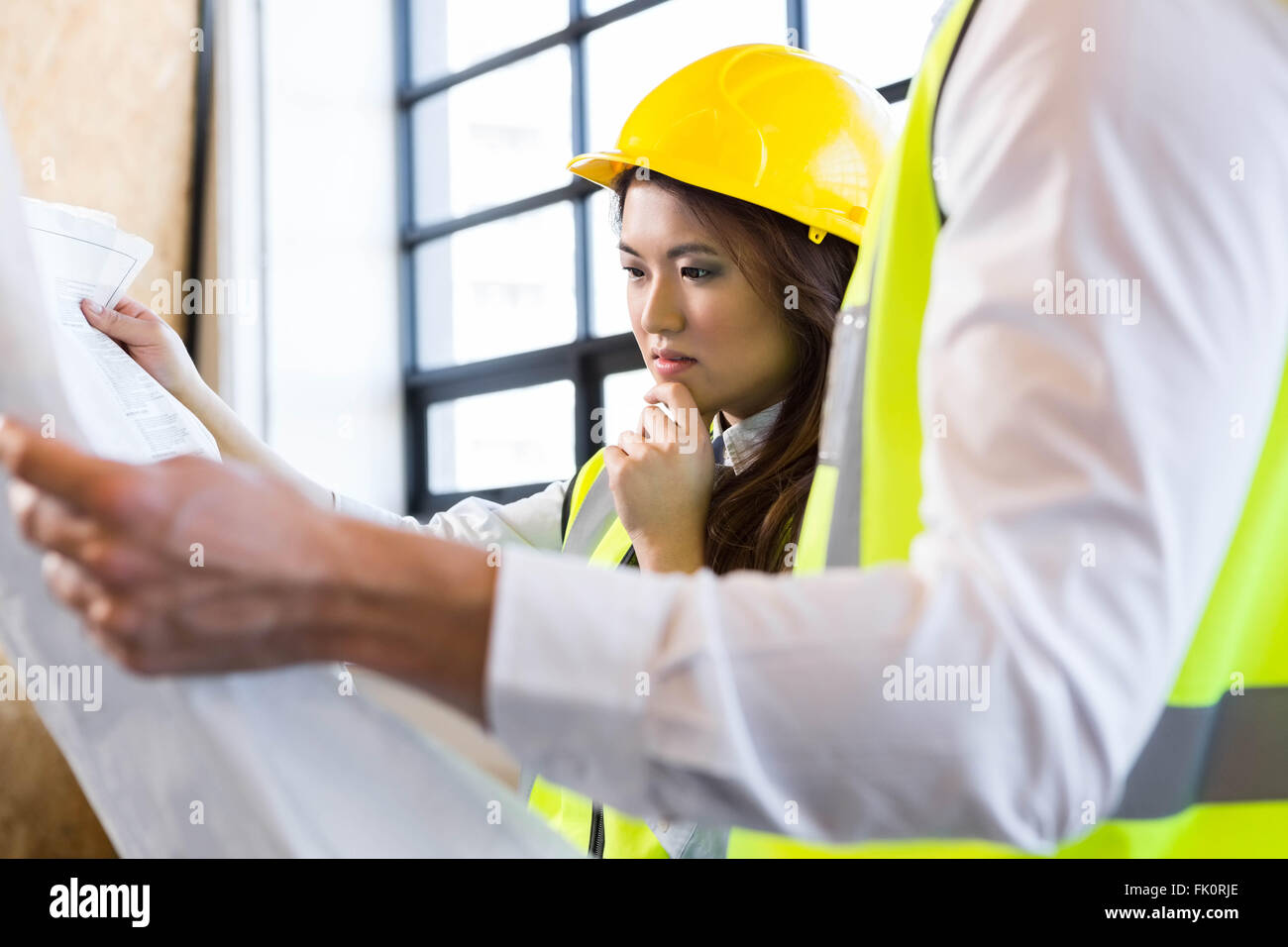 Architects Looking At Blueprint Stock Photo Alamy Architects Looking At Blueprint Stock Photo Alamy