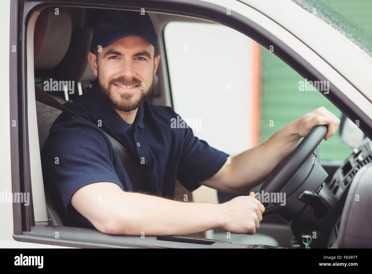 Delivery man sitting in his van Stock Photo Alamy