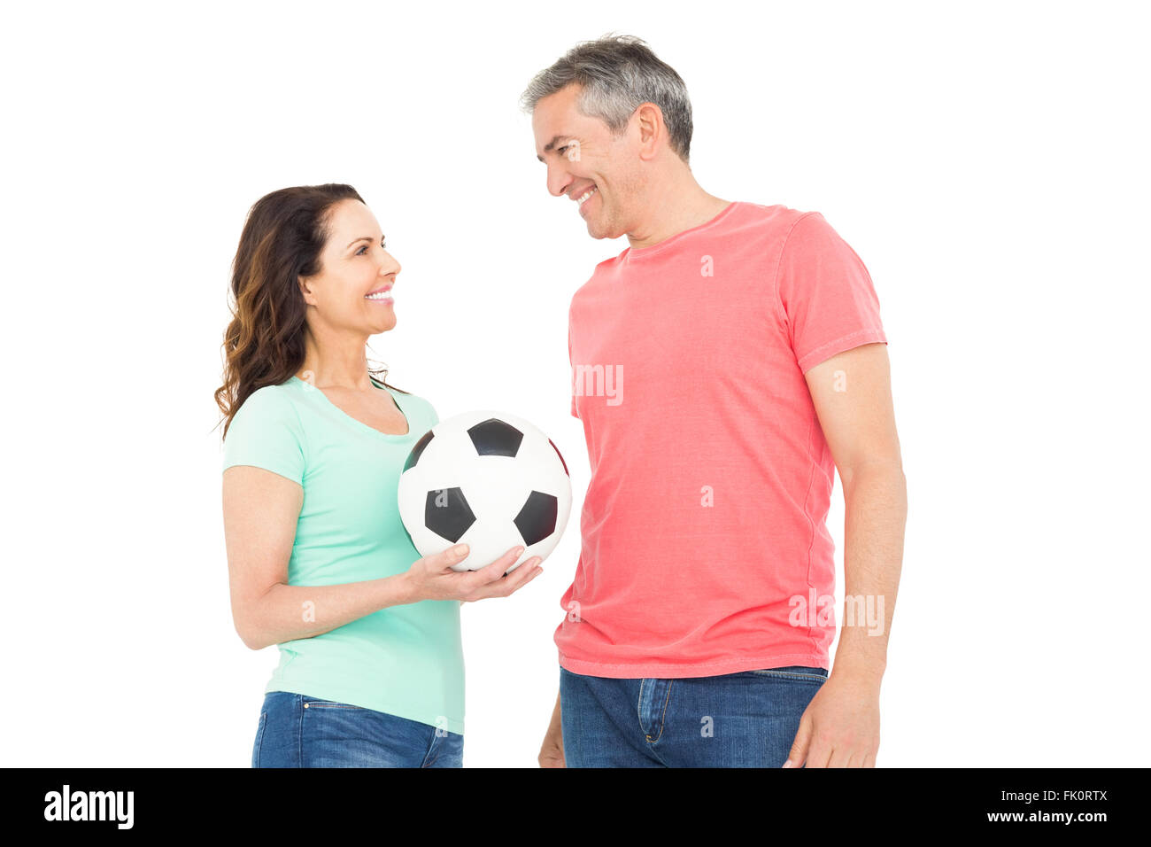 Excited football fan couple cheering at camera Stock Photo