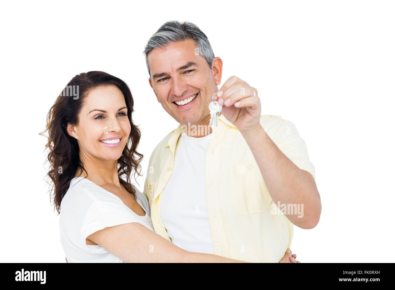Portrait of happy couple holding home keys Stock Photo - Alamy
