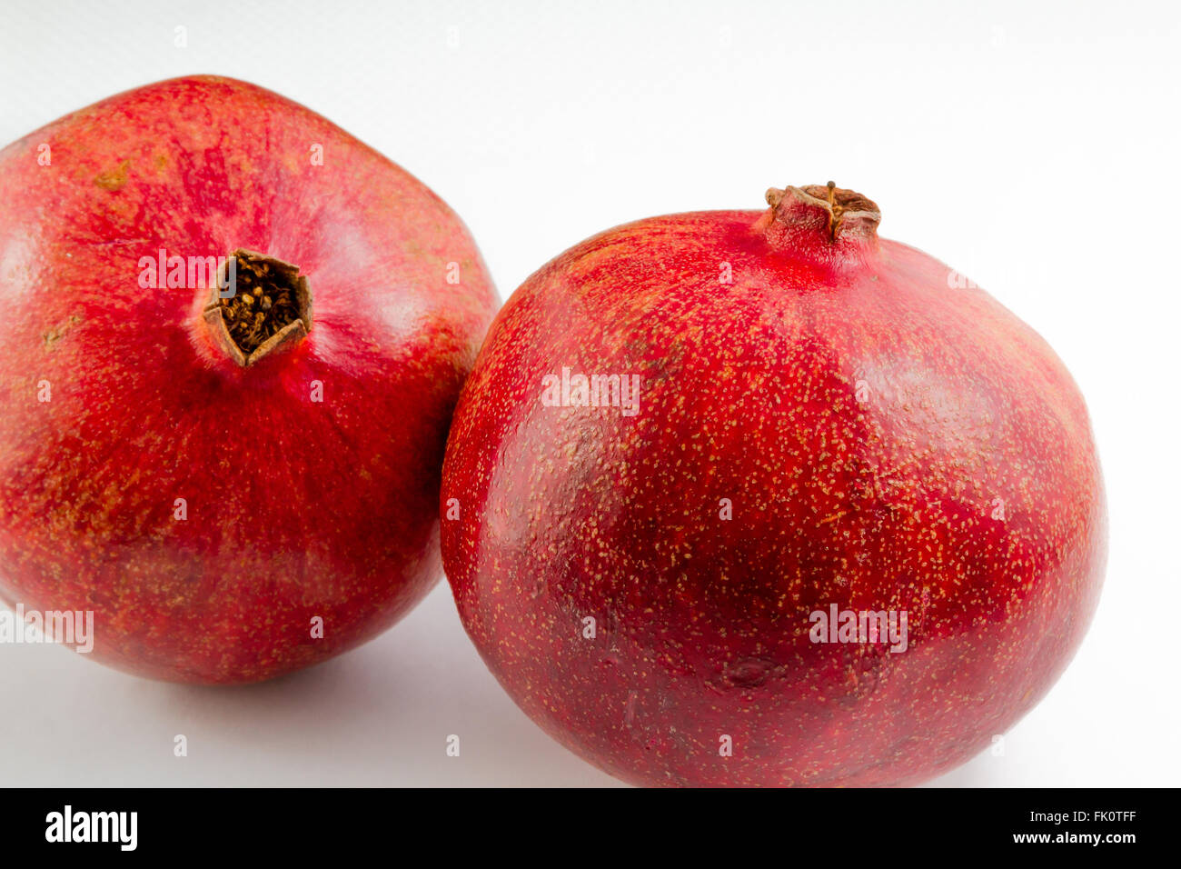 Two pomegranates on a white background Stock Photo