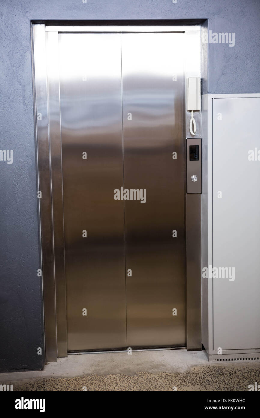 Modern elevator with closed door Stock Photo