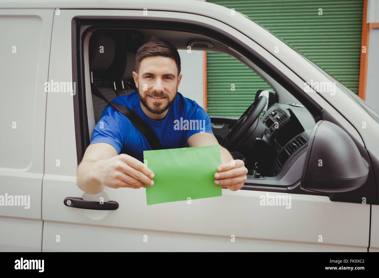 Man sitting in his van Stock Photo