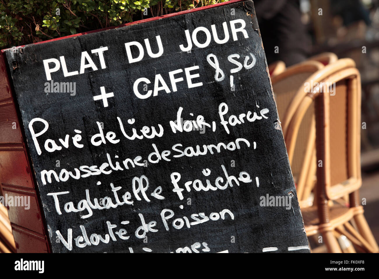 Restaurant Cafe in Paris with menu board. Stock Photo