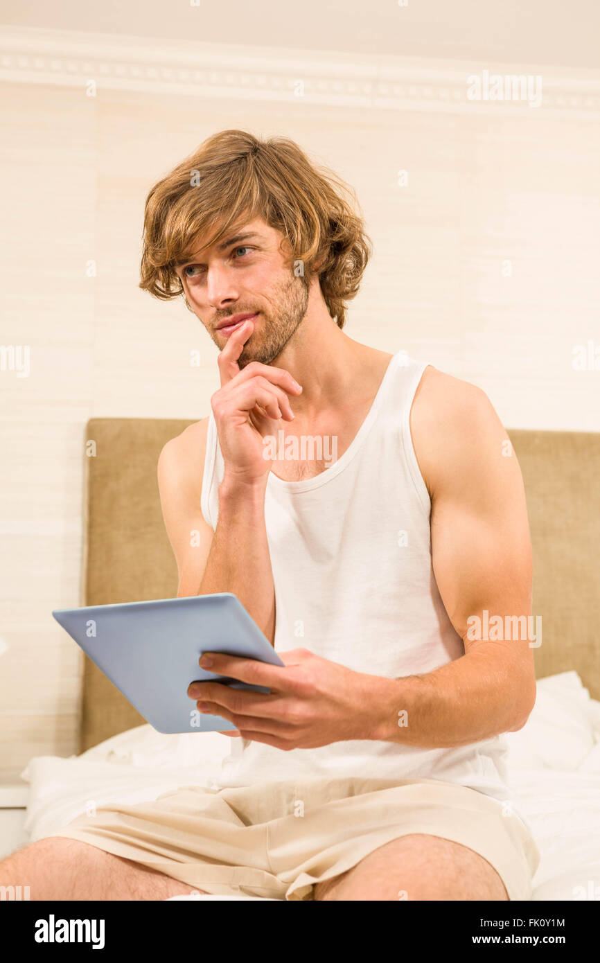 Handsome man using tablet computer Stock Photo