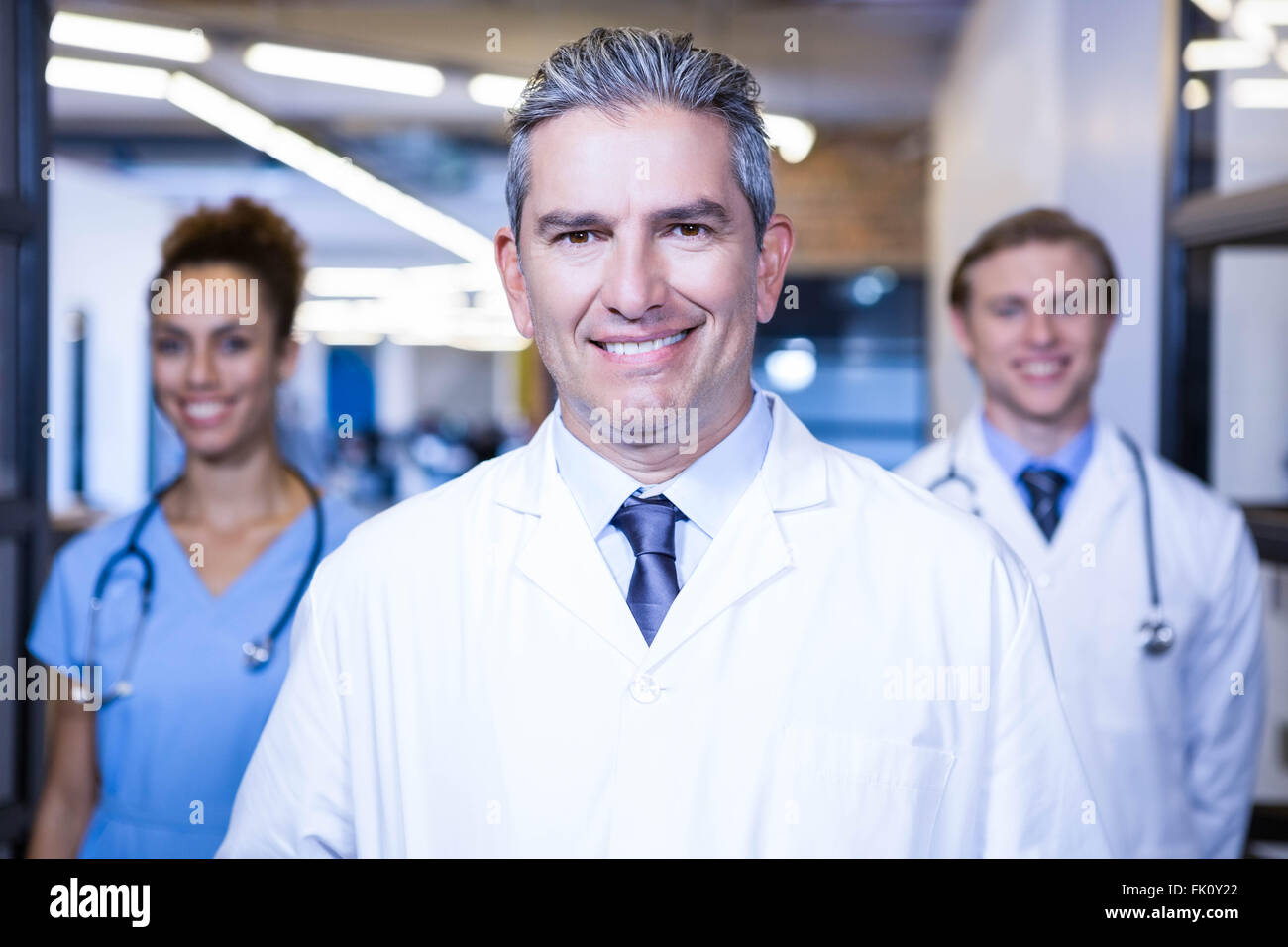 Portrait of medical team smiling at camera Stock Photo Alamy