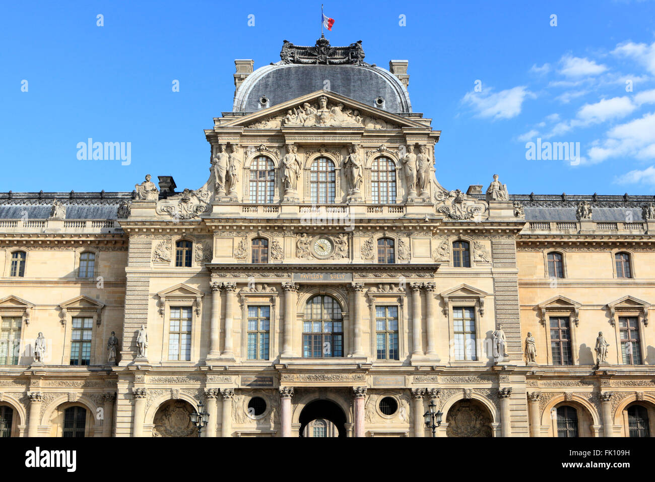 Renaissance architecture at the Louvre Museum in Paris bathed in warm late afternoon light. Stock Photo
