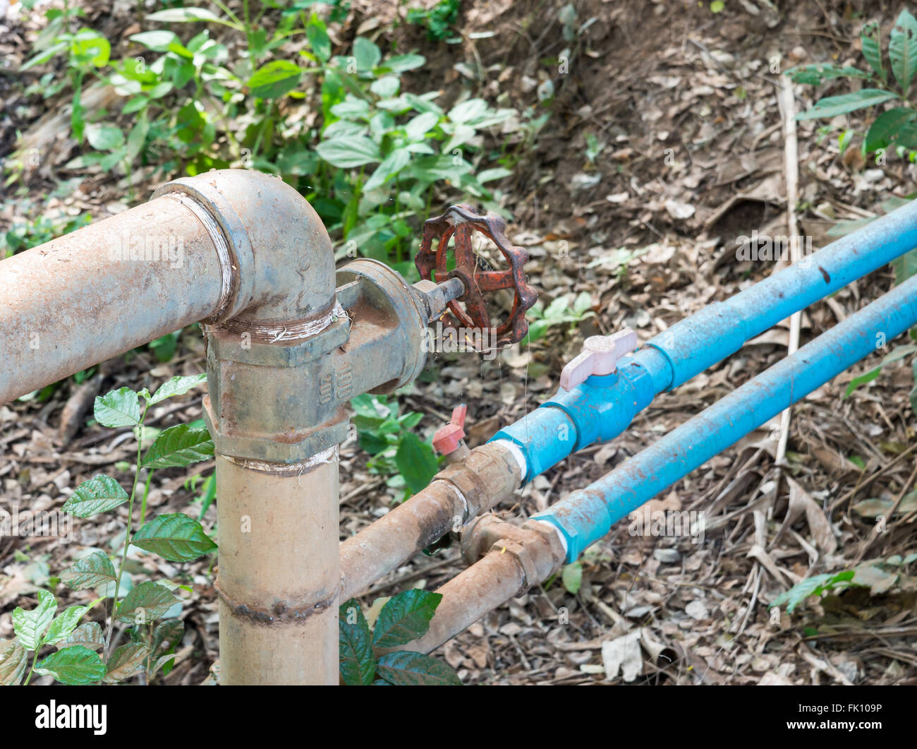 Old steel pipe with small pvc pipe for farming in the countryside of
