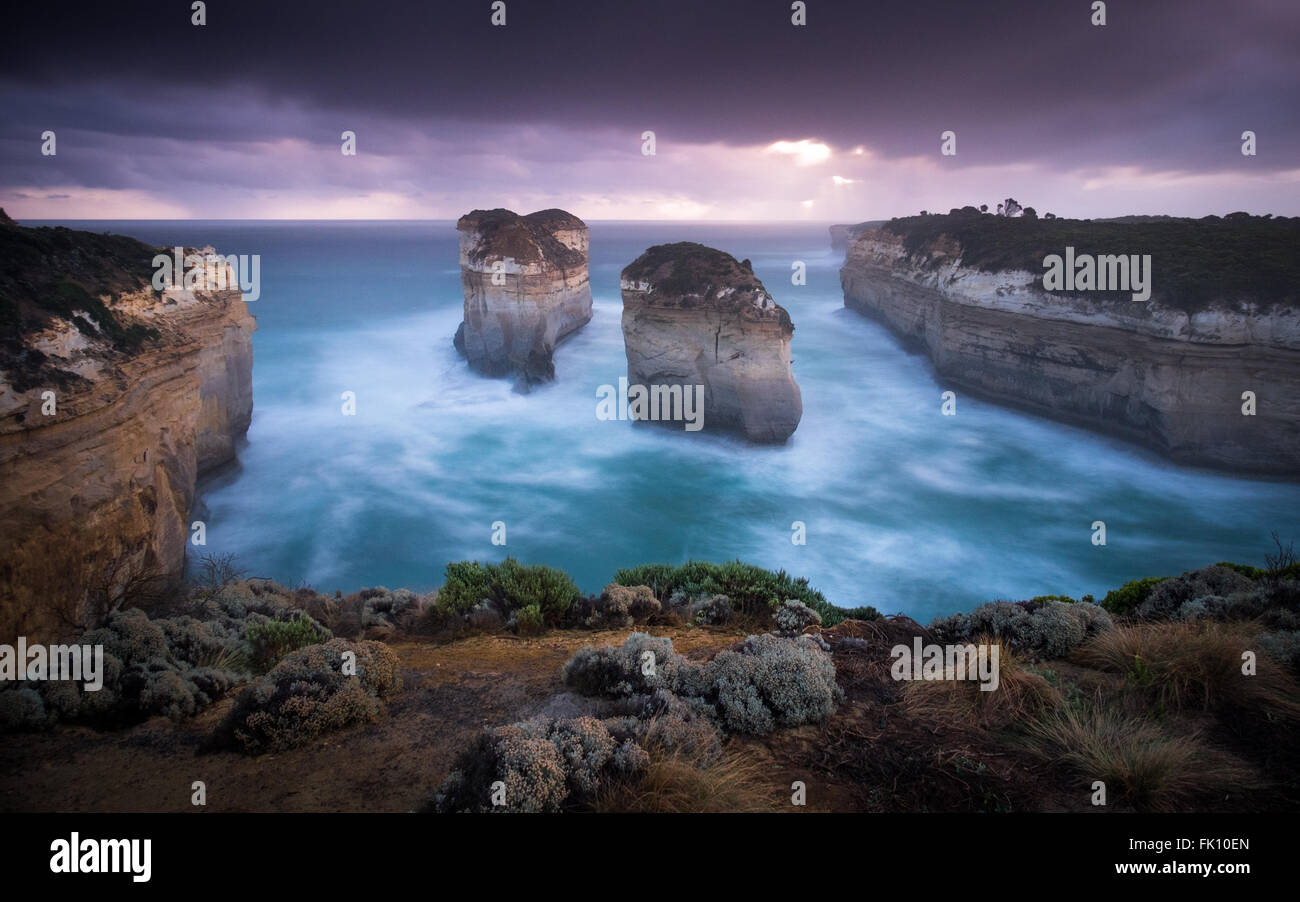 Two sea stacks (pillars), formerly connected and called Island Arch, along Australia's Great Ocean Road. The arch collapsed in 2009. The stacks are now called Tom and Eva after the two teenage survivors of the nearby Loch Ard shipwreck. Stock Photo