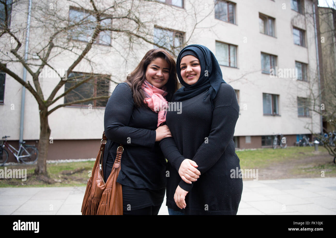 Berlin, Germany. 3rd Mar, 2016. Zahraa Elhasoon (l) and her sister Samah Elhasoon, refugees from Iraq, standing in front of a residential home for fled women and families in Berlin, Germany, 3 March 2016. Photo: Bernd von Jutrczenka/dpa/Alamy Live News Stock Photo