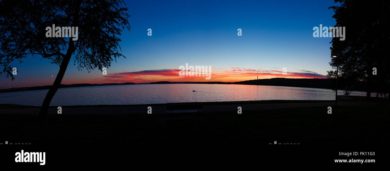 Calm sunset and clouds over lake Stock Photo - Alamy