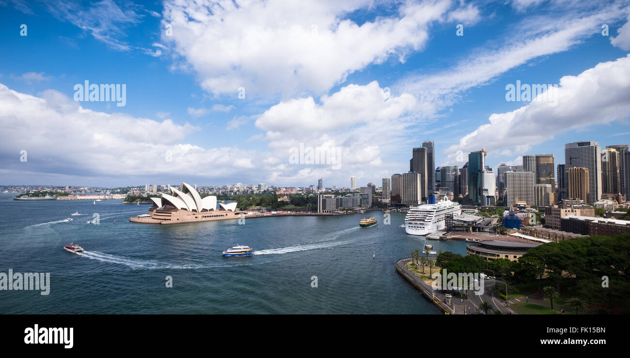 A panorama of Sydney Harbour from Sydney Harbour Bridge. P&O Cruises ship, Aurora, is berthed at the passenger terminal (right) Stock Photo